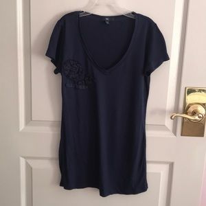 Navy blue v neck jersey shirt with flower detail